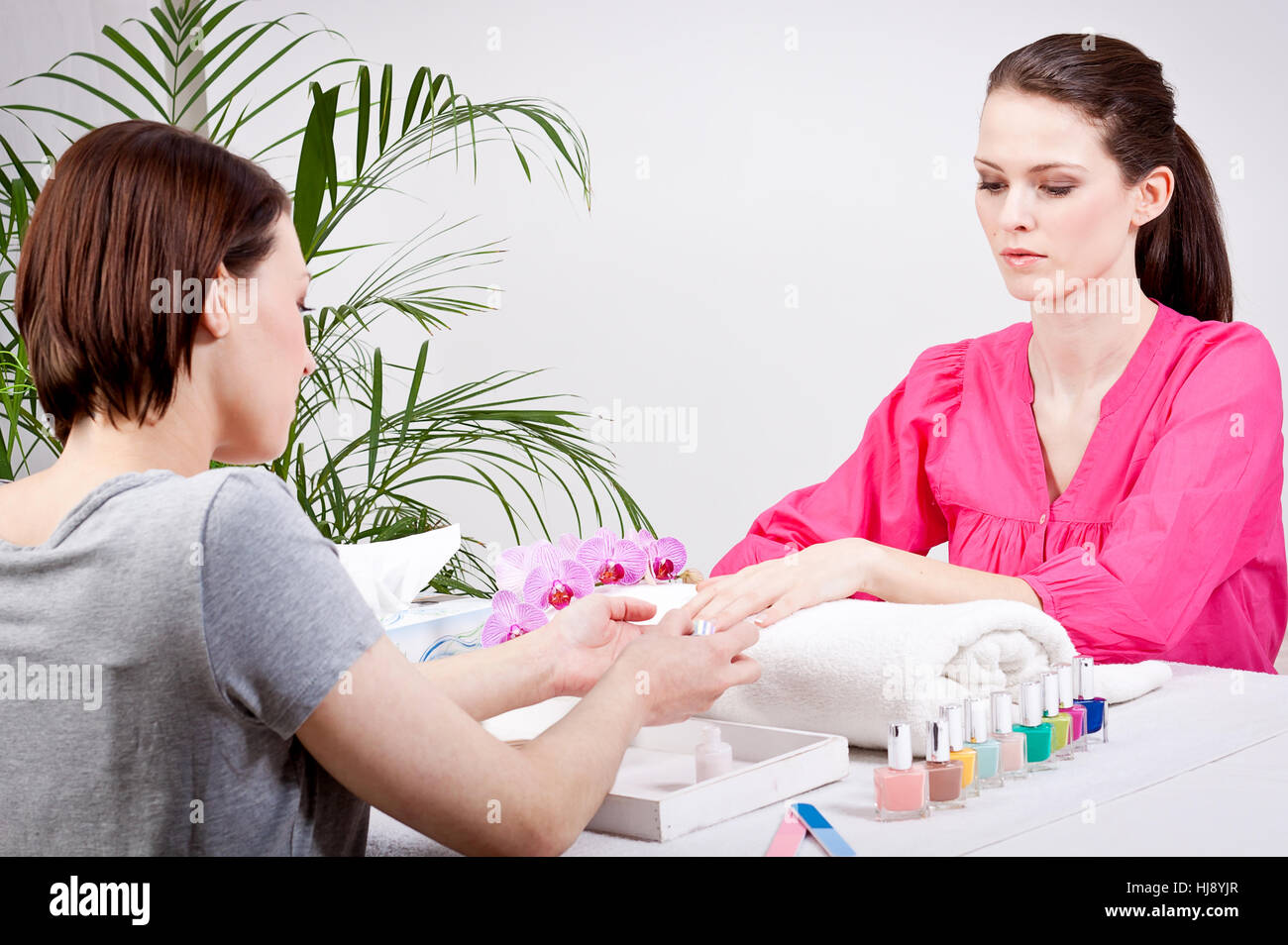 nail salons young woman in nail studio manicure Stock Photo