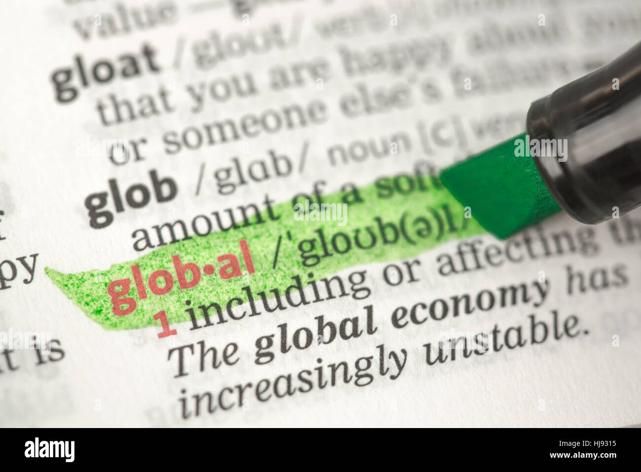 Global definition highlighted in green in the dictionary Stock Photo