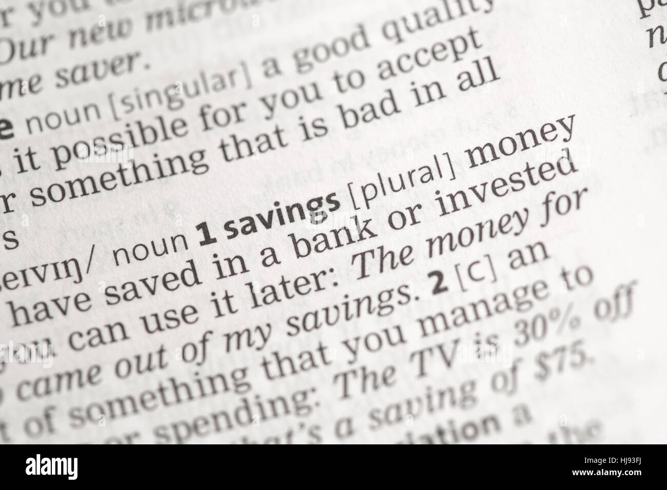 Savings money definition in the dictionary Stock Photo Alamy