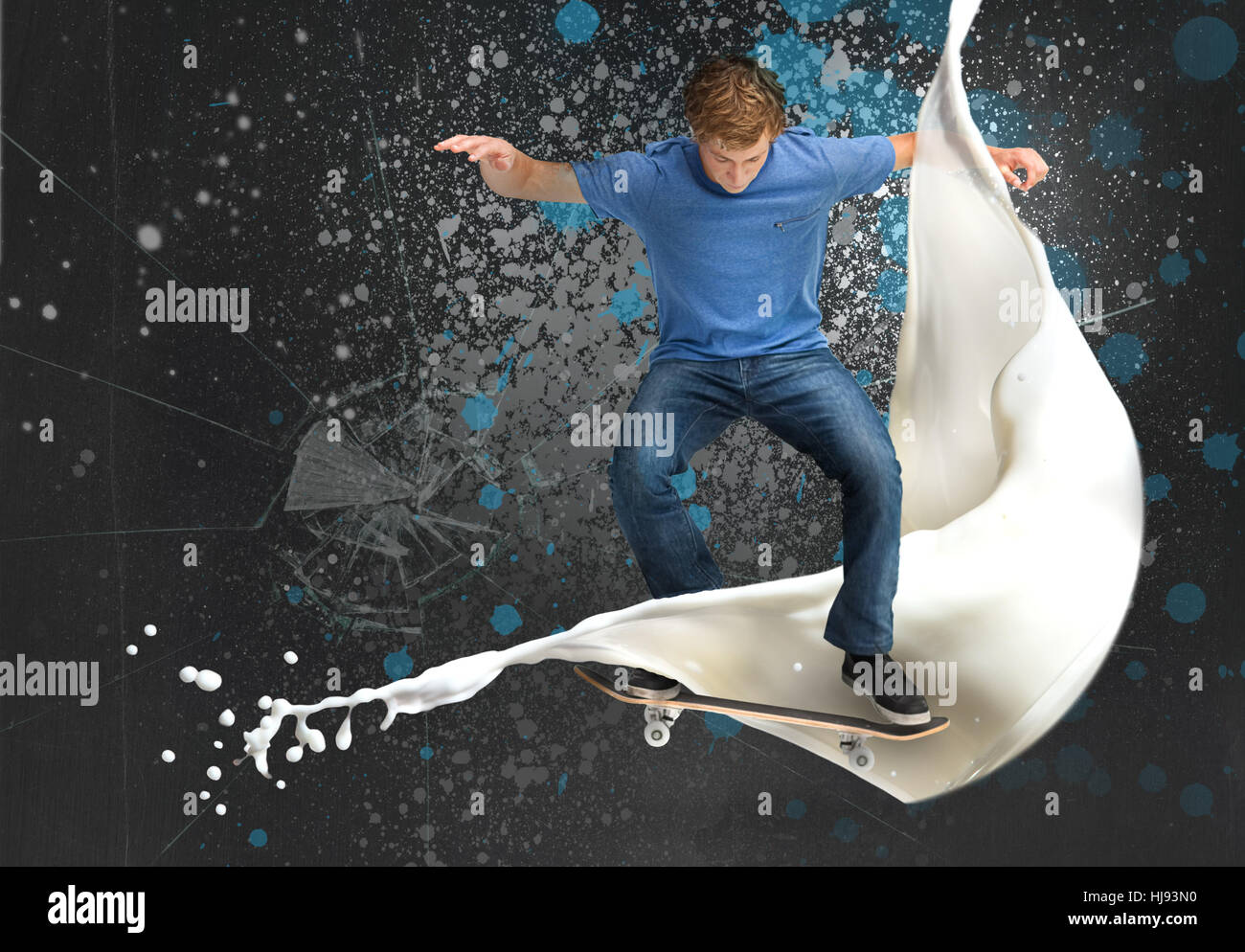 Skateboarder doing an ollie trick with white paint detail on spray painted background Stock