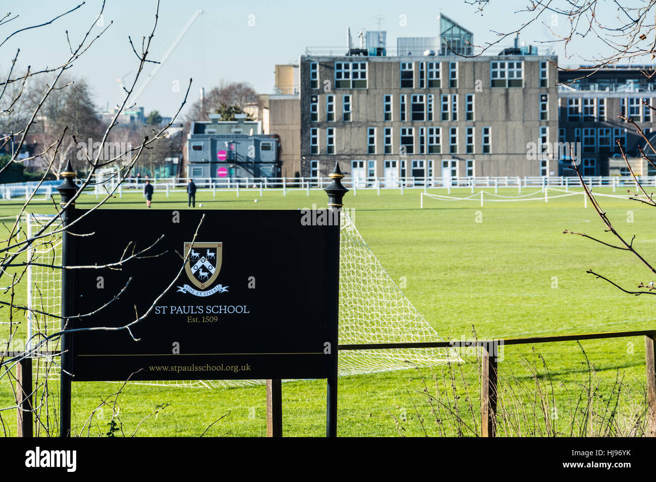 Playing fields and school sign outside St Paul's public school in SW