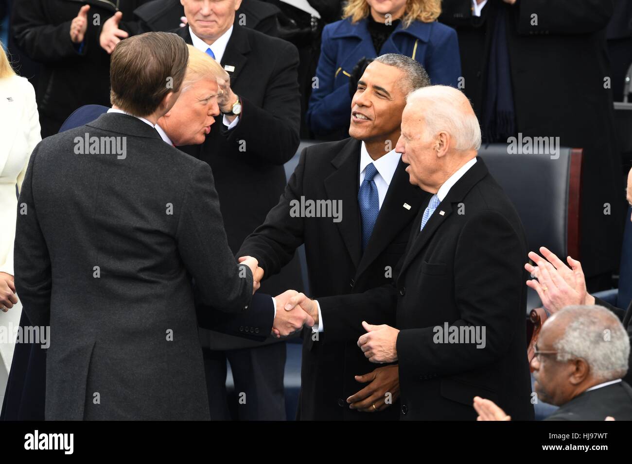 President Donald Trump thanks former Vice President Joe Biden as Eric Trump thanks former President Barack Obama following Inaugural ceremony after being sworn-in as the 45th President on Capitol Hill January 20, 2017 in Washington, DC. Stock Photo