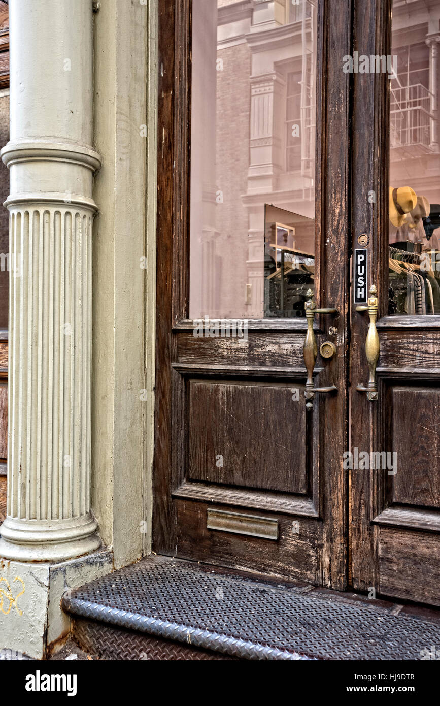 New York City, Manhattan, Soho.  Entrance to a Retail Store, Located in an Historic Cast Iron Building. Stock Photo