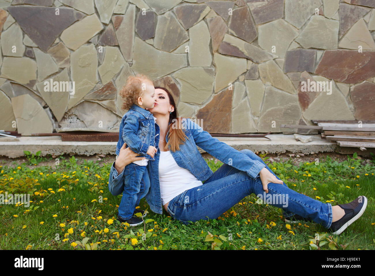Mother and daughter in a spring park 