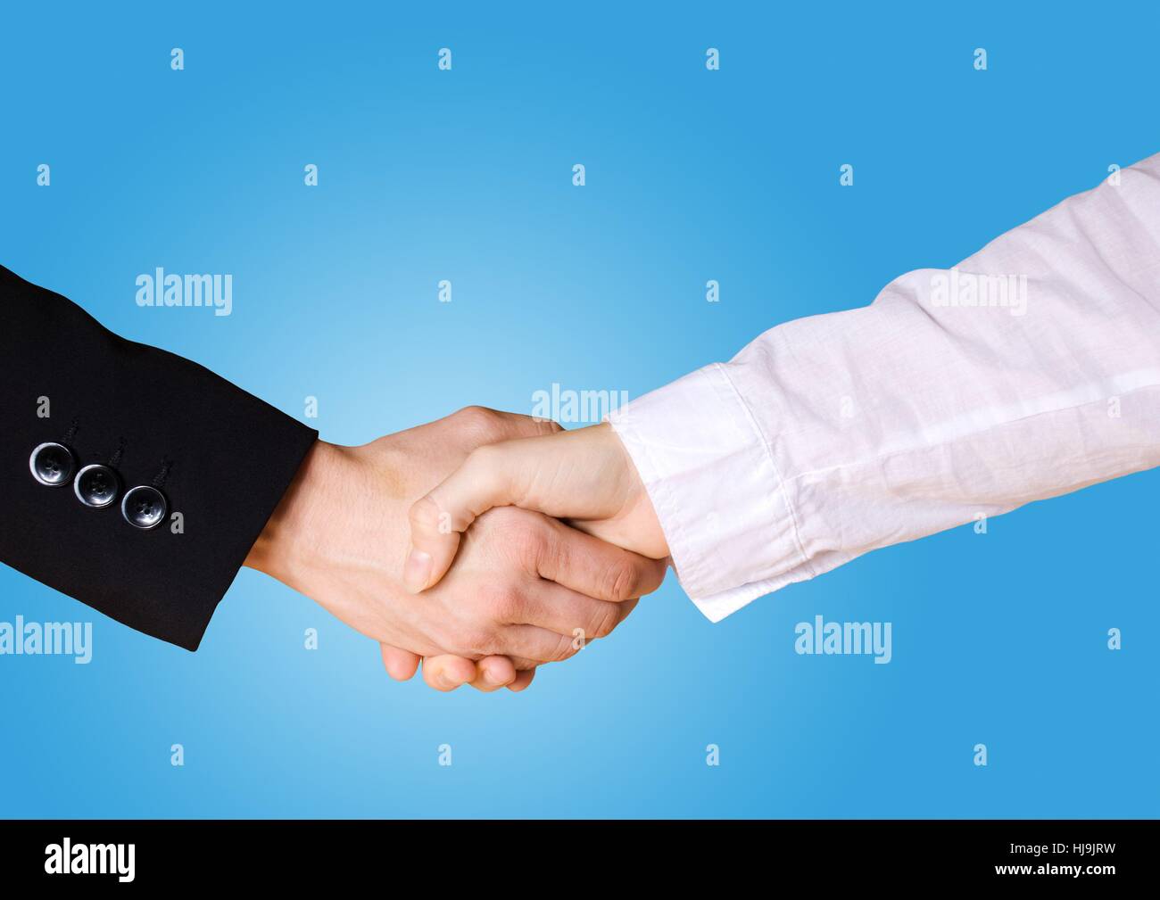 a handshake between two people in business cloth with blue background ...