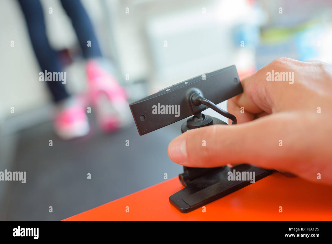 Hand fixing surface mounted camera Stock Photo - Alamy