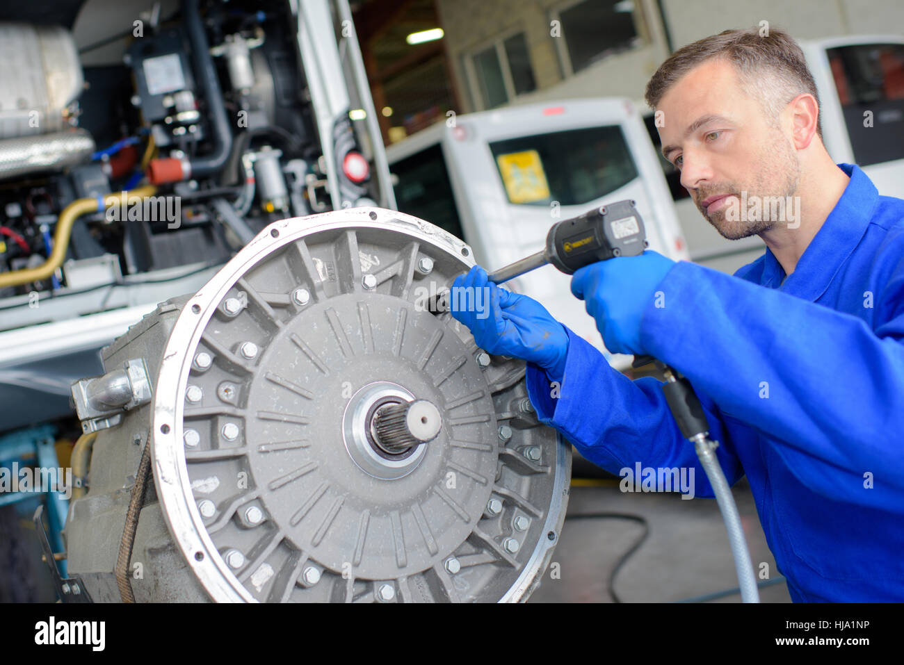 Mechanic using air powered tool Stock Photo Alamy