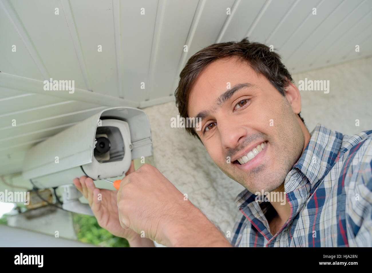 Fitting a security camera Stock Photo Alamy