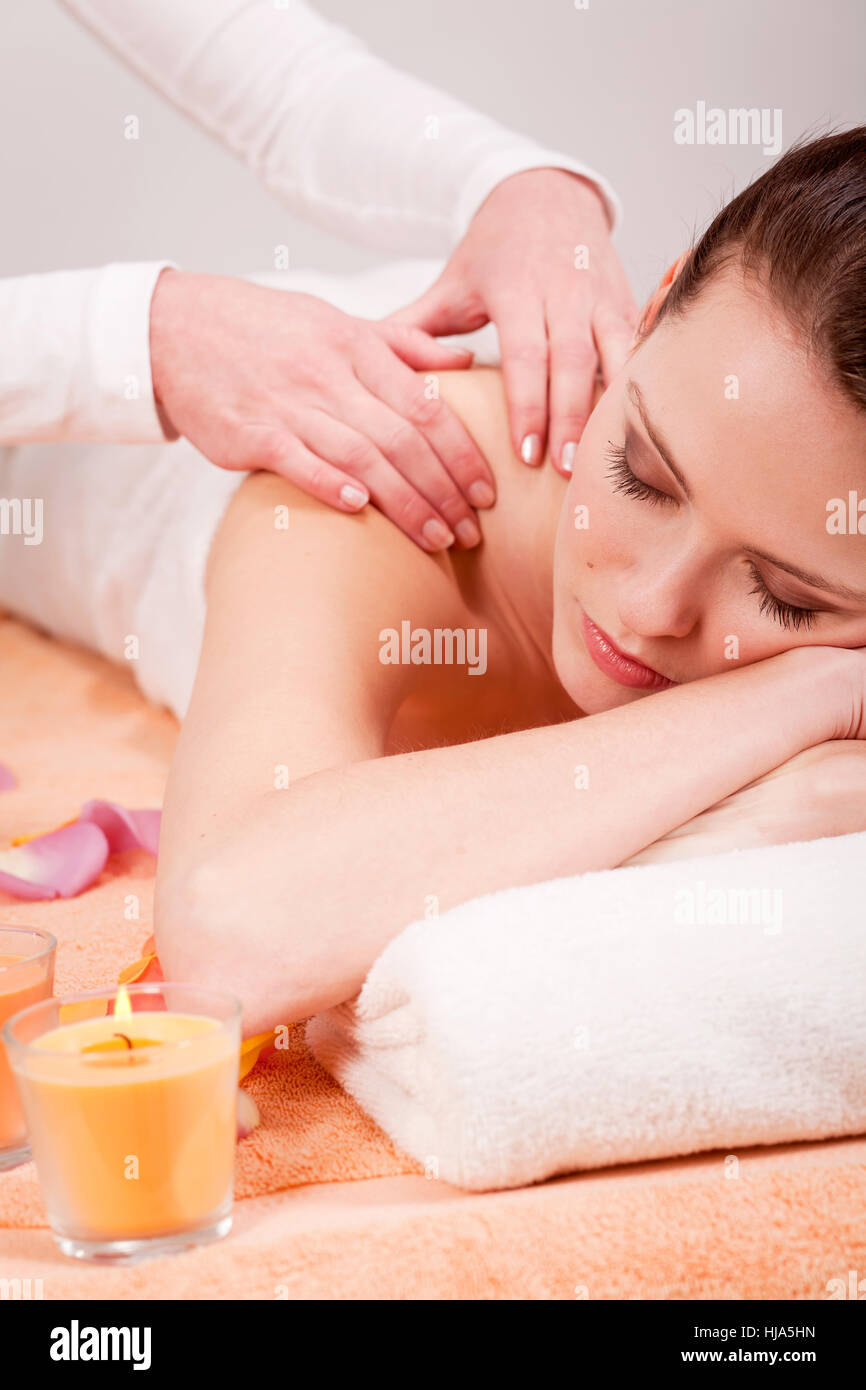 massage young woman with a back neck Stock Photo