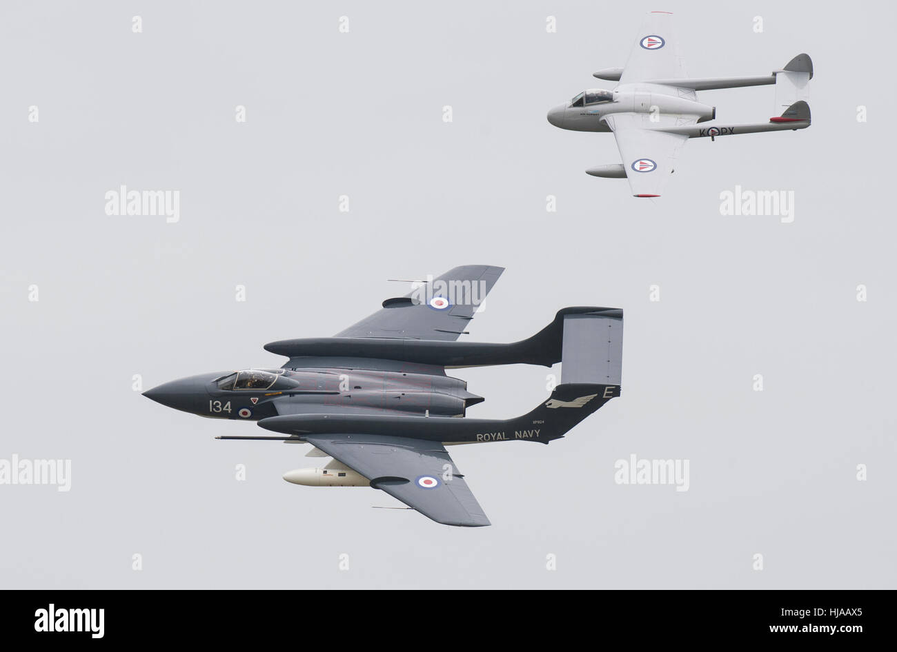 A Vampire and Sea Vixen in a flypast to celebrate the life of former test pilot Eric 'Winkle' Brown at at RNAS Yeovilton. Stock Photo