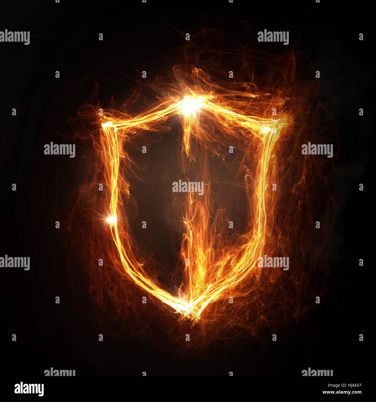 Glowing fire shield icon on dark background Stock Photo - Alamy