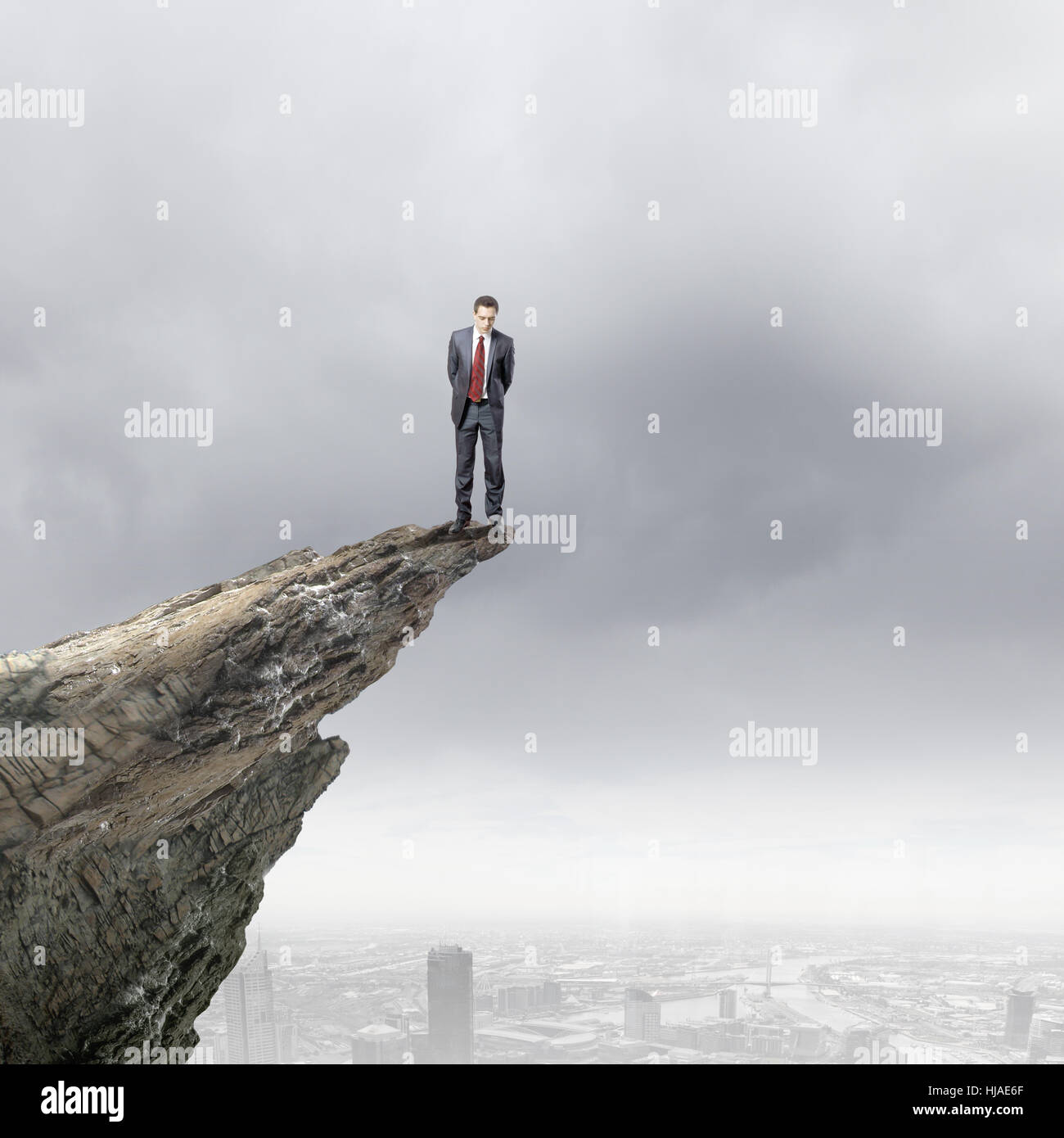 Man standing on cliff edge hi-res stock photography and images - Alamy