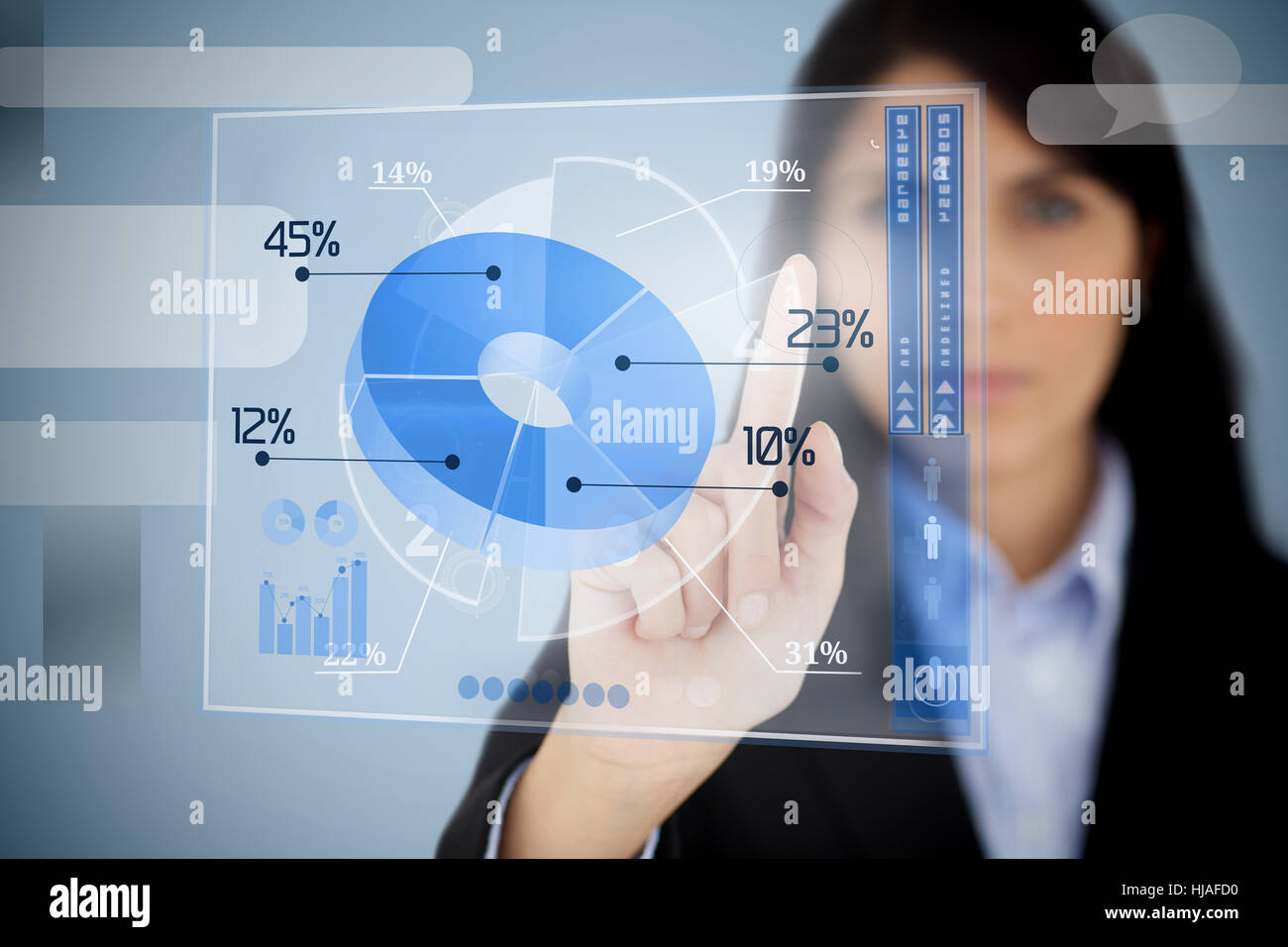 Serious businesswoman using blue pie chart interface by touching it