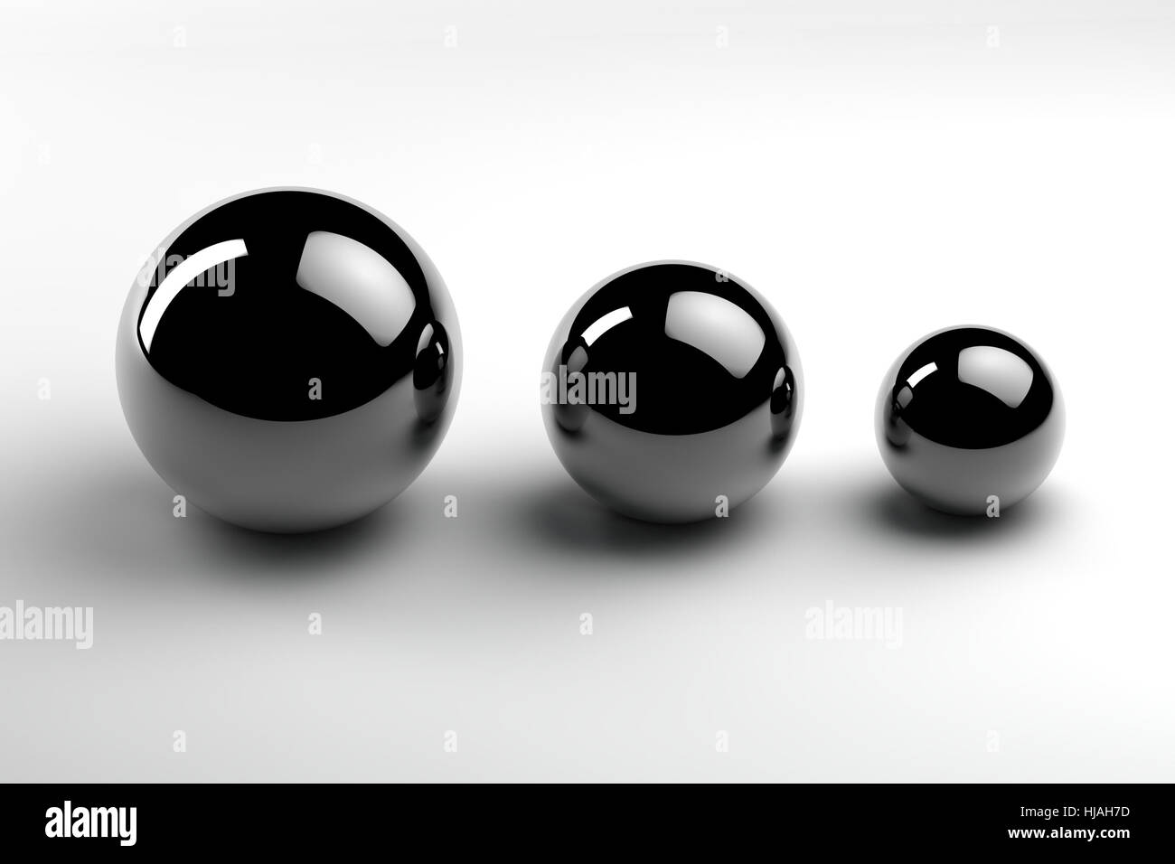 chrome balls of three different sizes Stock Photo Alamy