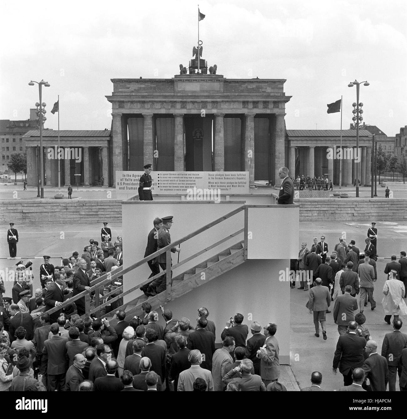 US president John F. Kennedy visits a view point at the Berlin Wall on