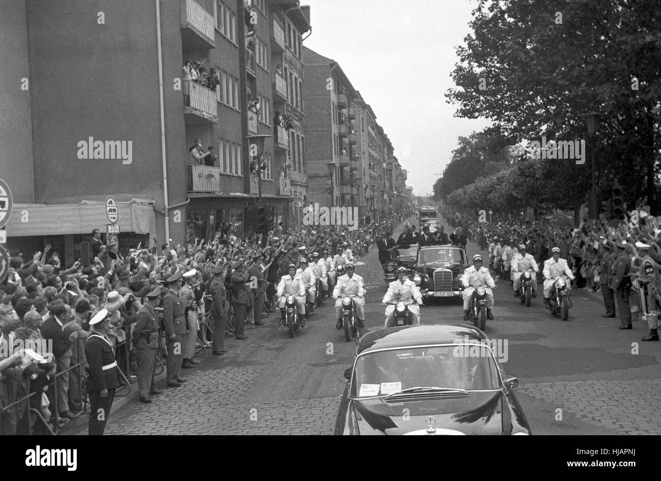 Cheering crowd at the roadside. After visiting a NATO military parade ...