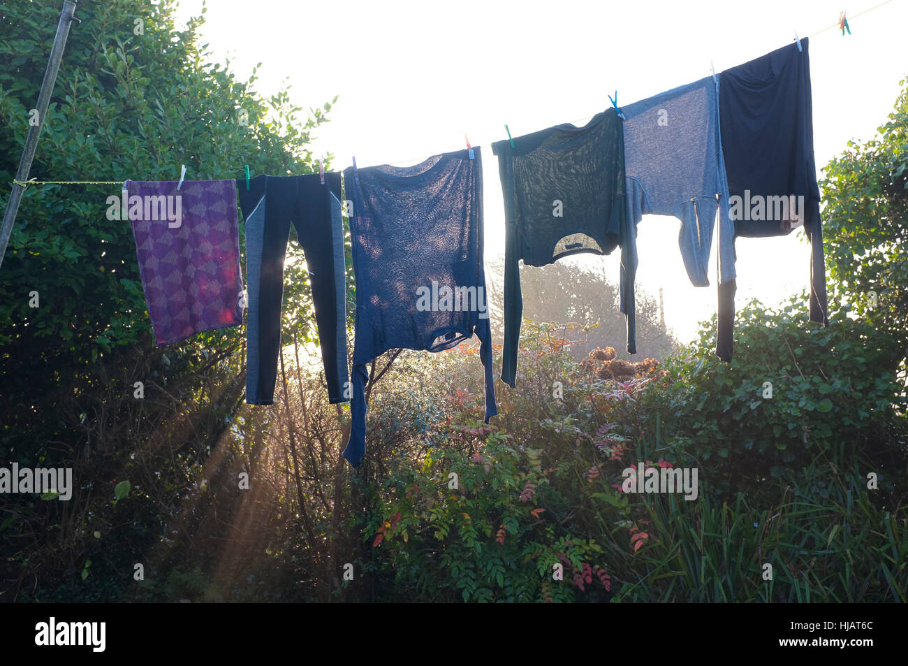 Washing hanging out to dry in the early morning. Stock Photo