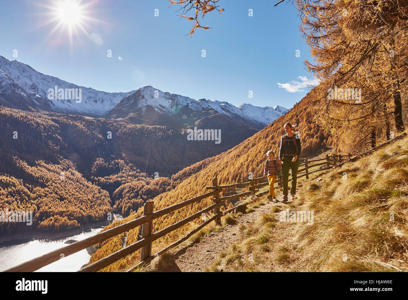 Mother and son hiking along pathway, Schnalstal, South Tyrol, Italy Stock Photo