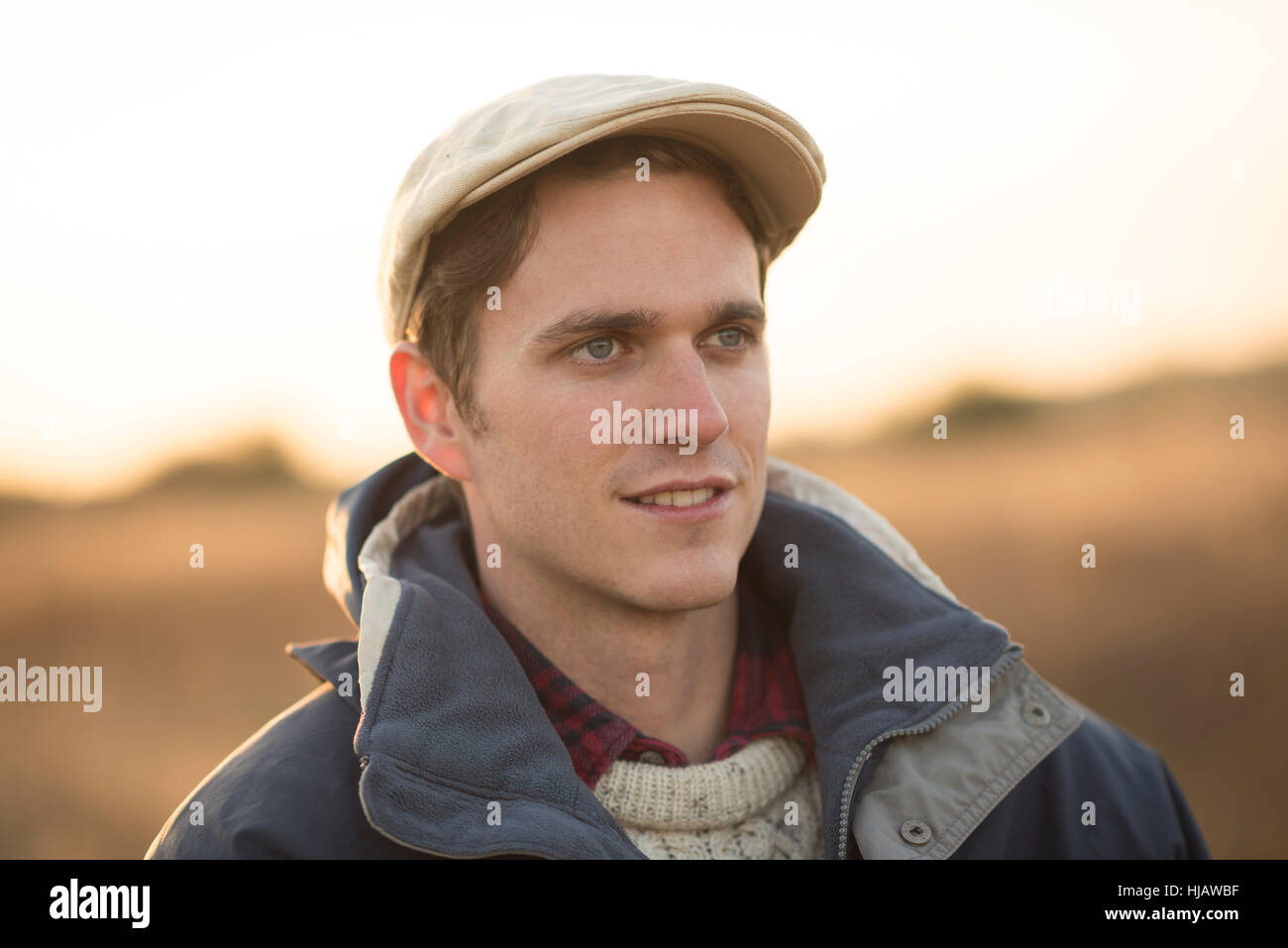 Young man wearing flat cap hi-res stock photography and images - Alamy