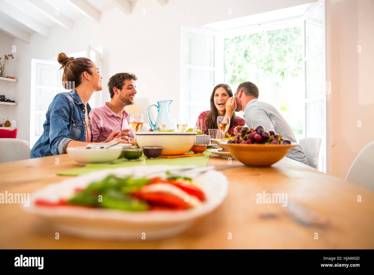 Friends dining together Stock Photo - Alamy