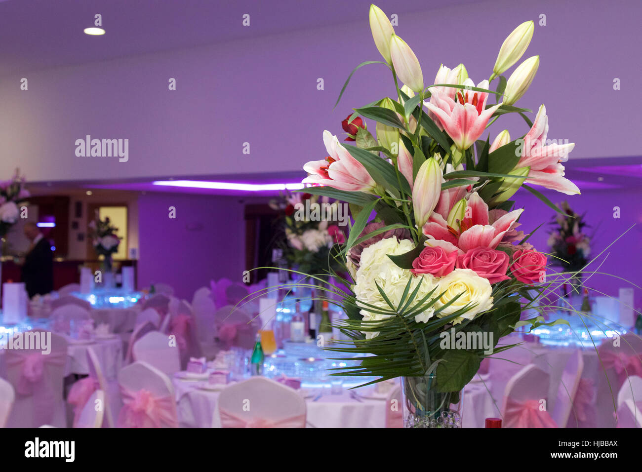 Flower arrangement on wedding breakfast table. photo by Adam Tiernan Thomas Stock Photo