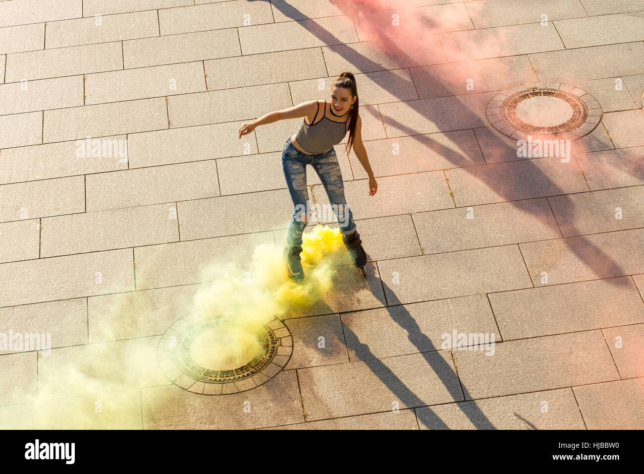 Young woman on rollerblades. Stock Photo