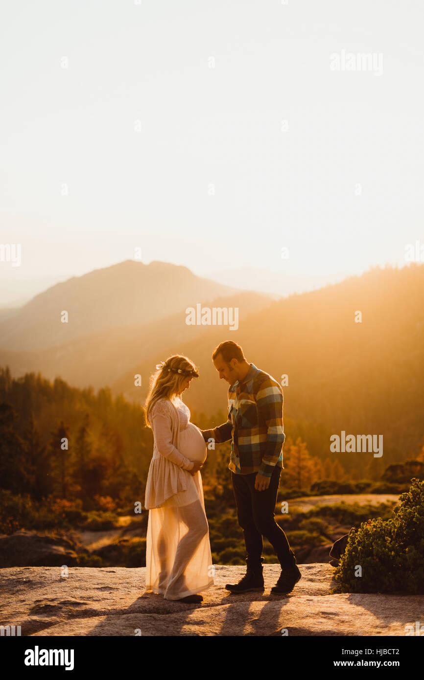 Pregnant couple in mountains, Sequoia national park, California, USA Stock Photo