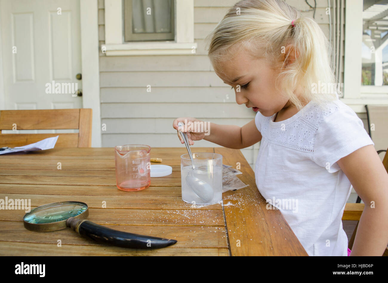 Young girl doing science experiment Stock Photo Alamy