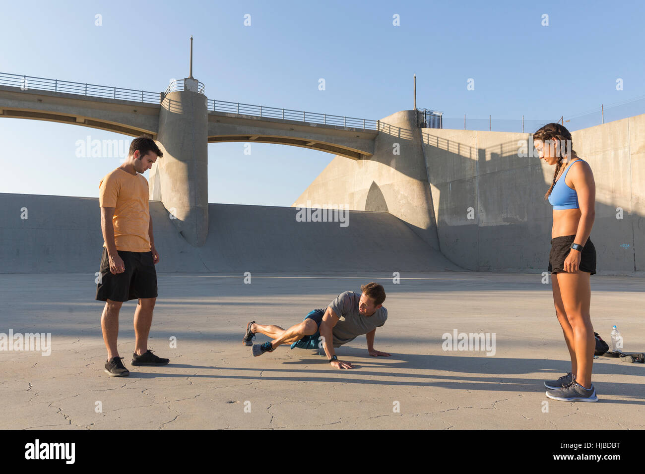 Athletes observing friend workout, Van Nuys, California, USA Stock Photo