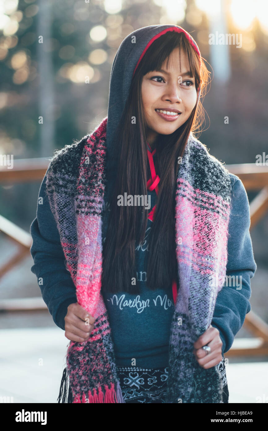 Fashionable young girl in cold weather wearing colorful scarf Stock Photo