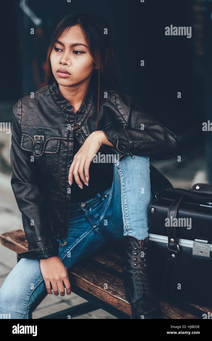 Gorgeous girl posing with leather bag, hipster style Stock Photo