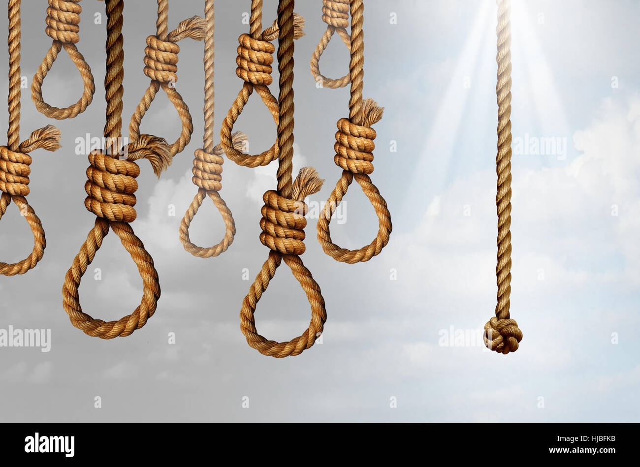 Despair and hope concept as a group of deadly hanging noose knots representing desperate suicidal psychological misery with one individual straight ro Stock Photo