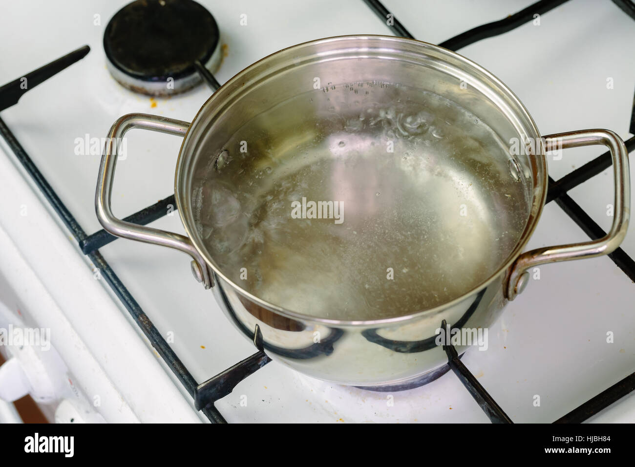 pan of boiling water on the gas stove closeup Stock Photo Alamy