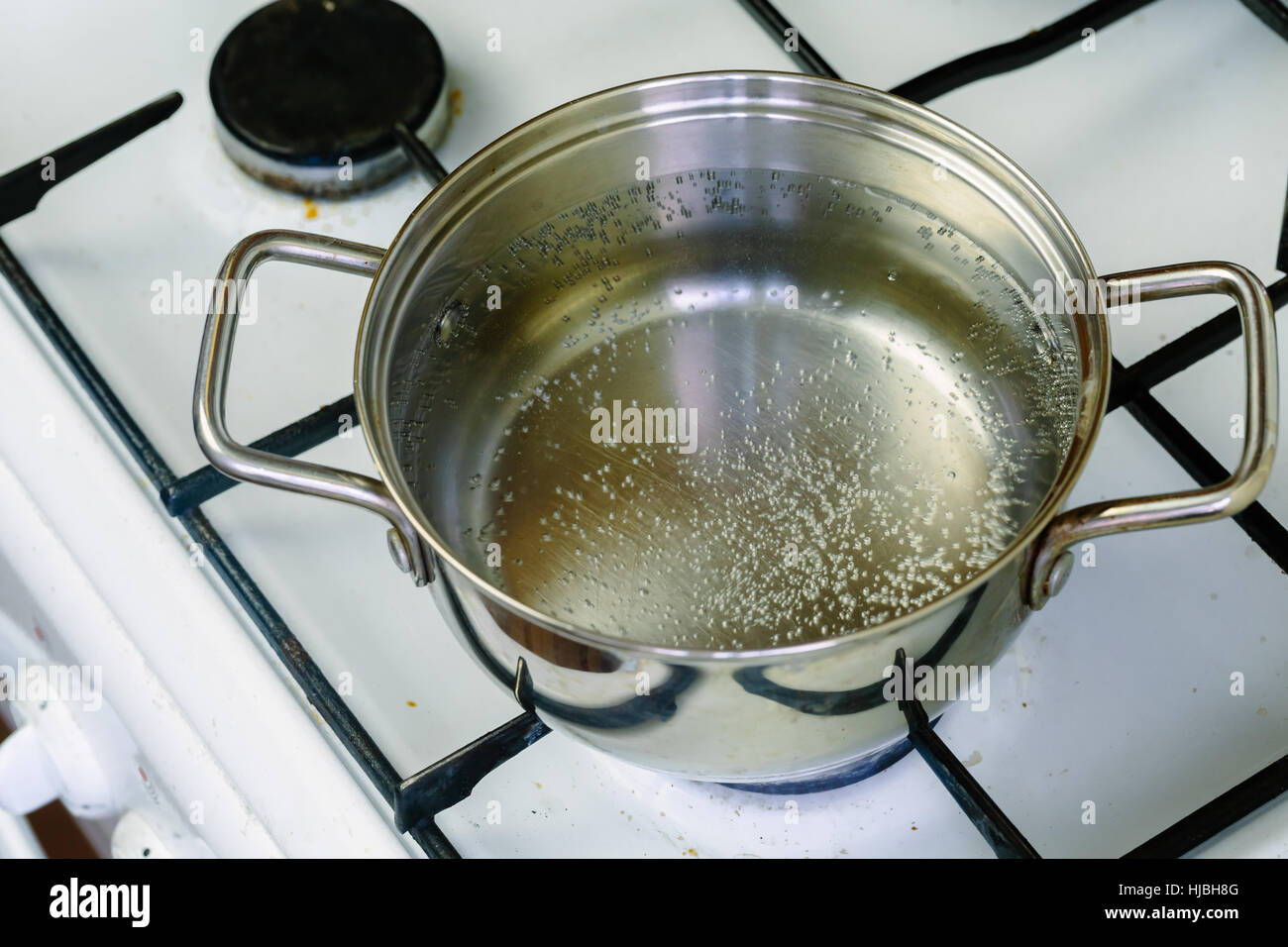 pan of boiling water on the gas stove closeup Stock Photo Alamy