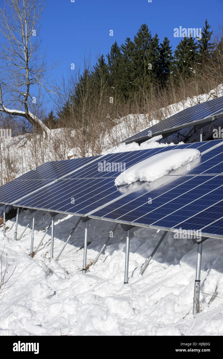 Solar panels in the snow in winter of photovoltaic power station