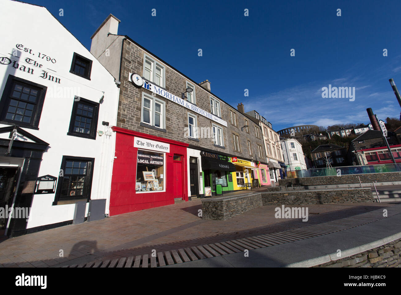 Town of Oban, Scotland. Picturesque colourful view of retail shops cafes and pubs at Oban’s Stafford Street. Stock Photo