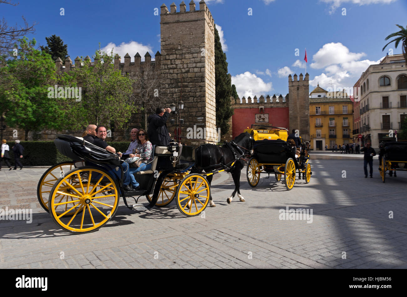 Passenger and driver in horse-drawn carriage in the Plaza del Trinfo. Stock Photo