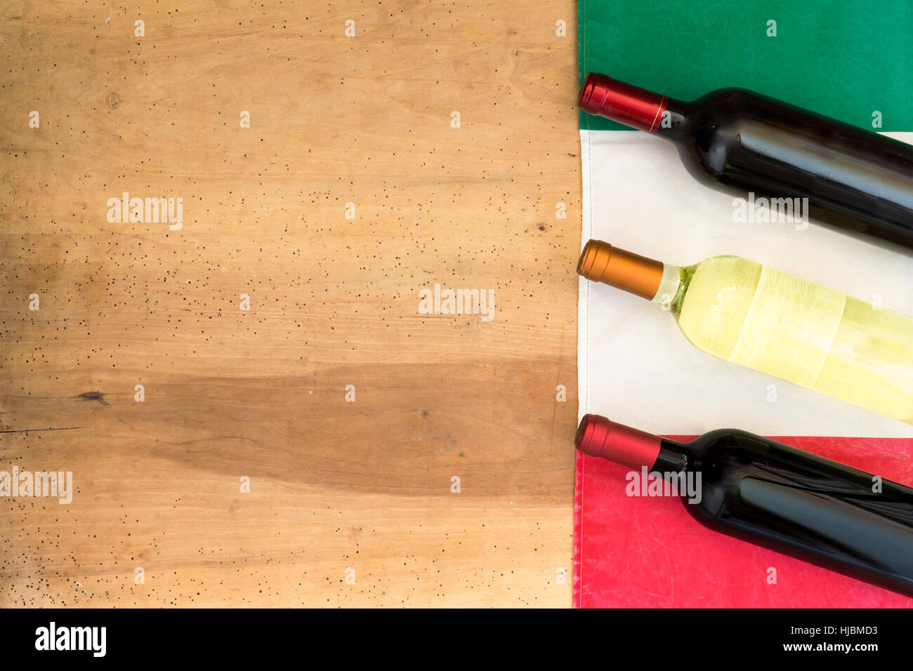 Italian wine bottles on wooden background Stock Photo