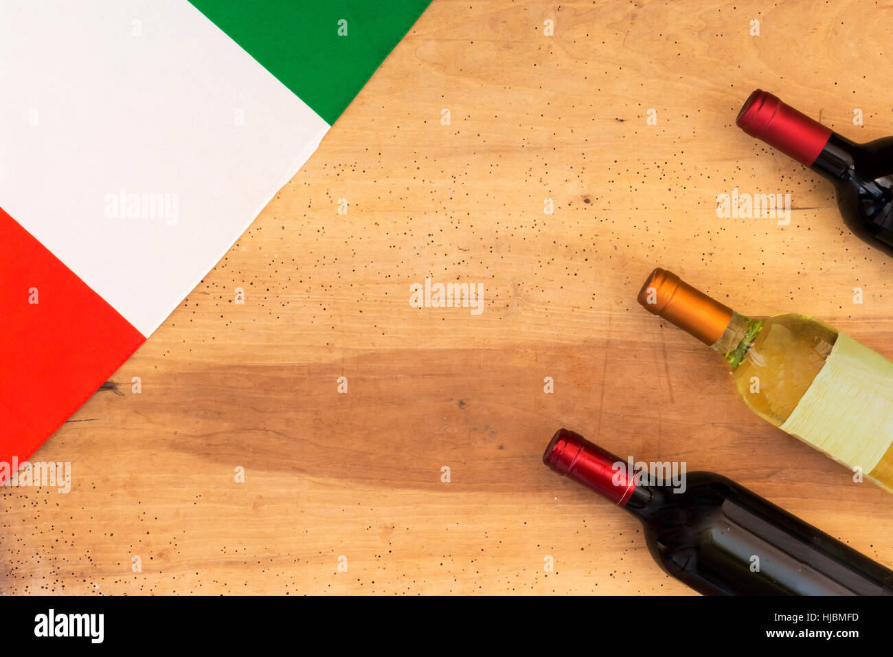 Italian wine bottles on wooden background Stock Photo