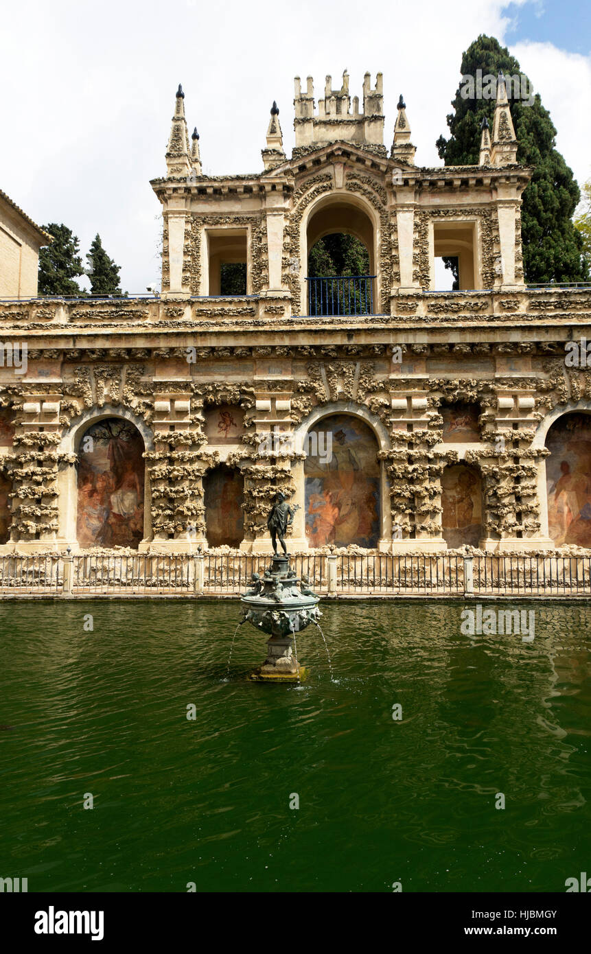 Real Alcázar Gardens, statue of Mercury in the Mercury Pool at East side, paintings on the walls. Stock Photo