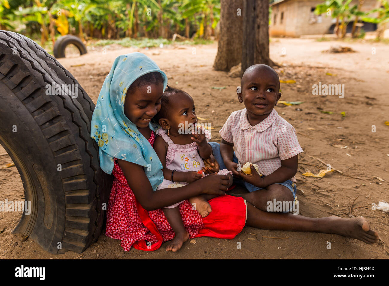 Uzi Island, Zanzibar, Tanzania - October 2016: Small children are hanging around instead of attending not existing kindergarten.Poverty in village. Stock Photo