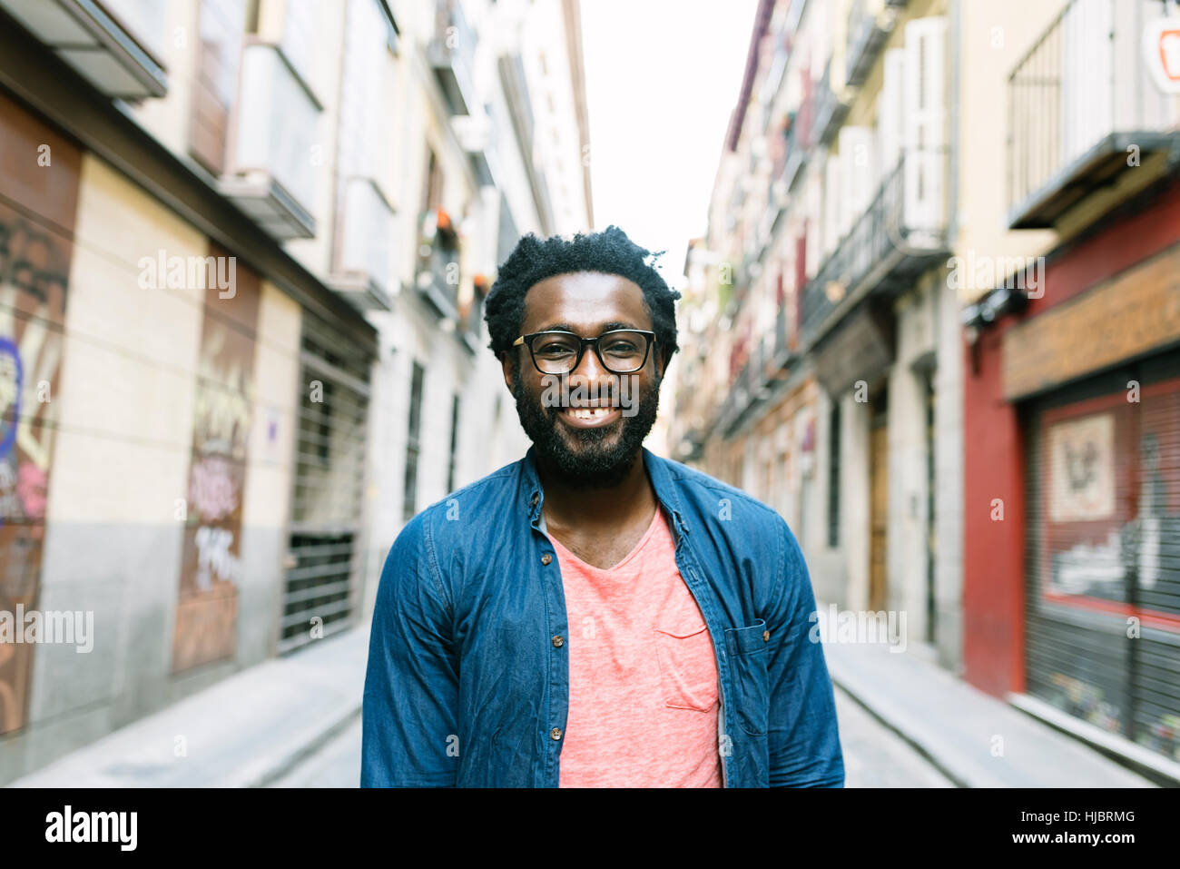 Portrait of a handsome young african man in the street Stock Photo - Alamy