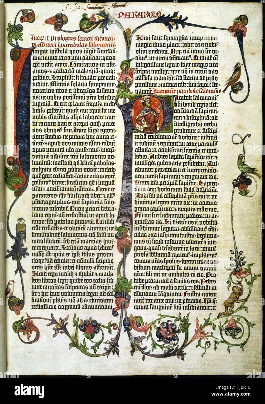 Page from the ‘Gutenberg Bible’ the first mass-produced book printed in Mainz, Germany in 1455 by Johann Gutenberg. Page shows showing a large illuminated ‘I’ and ‘P’ featuring a portrait of King Solomon. See description for more information. Stock Photo
