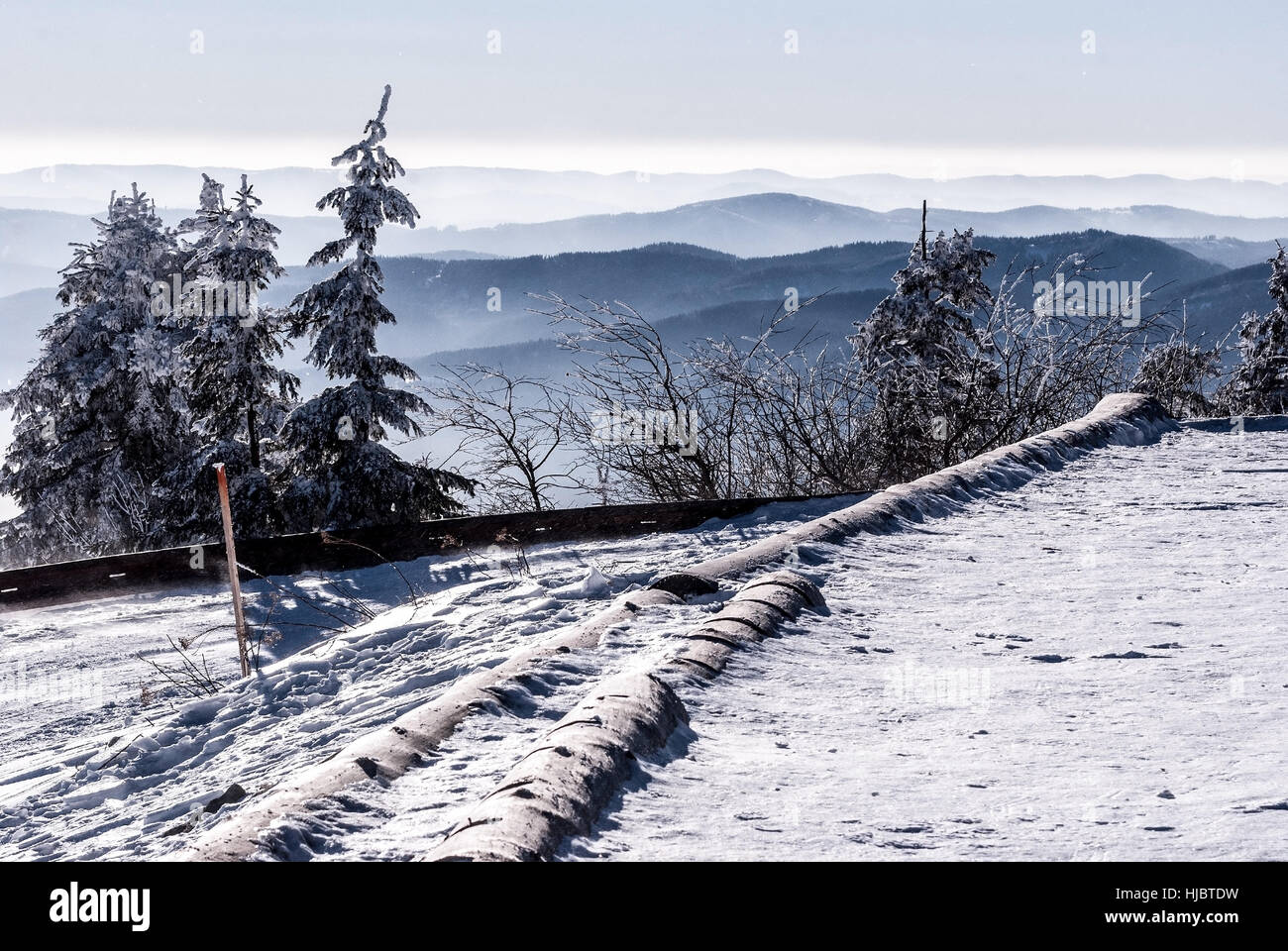 mountain ranges panorama from Lysa hora hill in Moravskoslezske Beskydy mountains during freezing winter day with clear sky Stock Photo