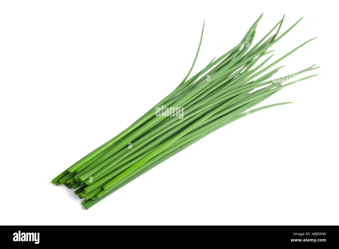 Bunch of chives on white background Stock Photo - Alamy