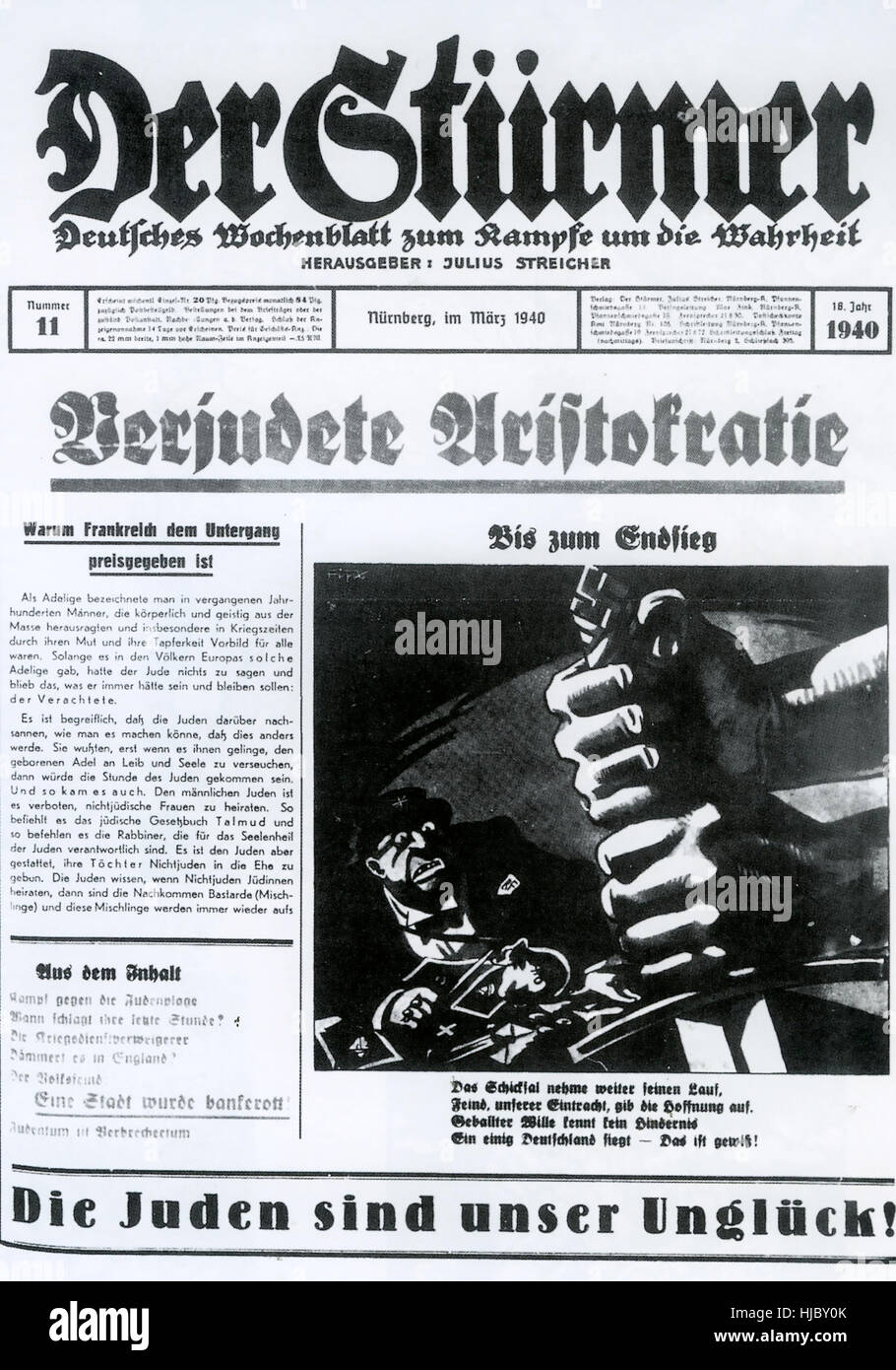 DER STÜRMER  weekly tabloid Nazi propaganda newspaper published by Julius Streicher from 1923 to 1945.This issue is from March 1940. The cartoons were by Philipp Rupprecht (Fips) . The bottom line 'The Jews are our misfortune' was used in every issue Stock Photo