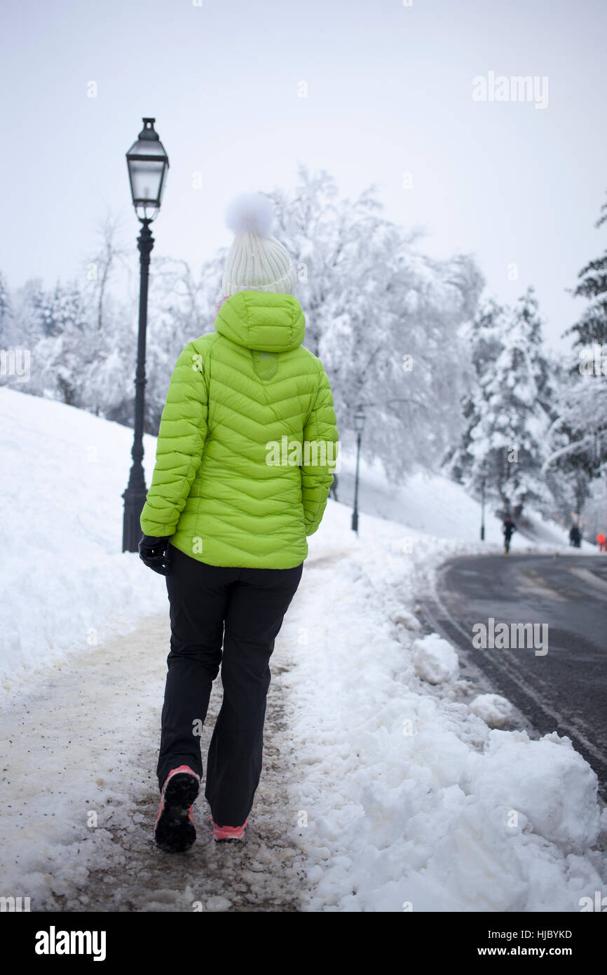 Woman walking snow vintage hi-res stock photography and images - Alamy