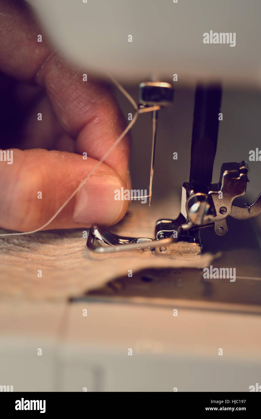 Threading Needle Thread High Resolution Stock Photography and Images