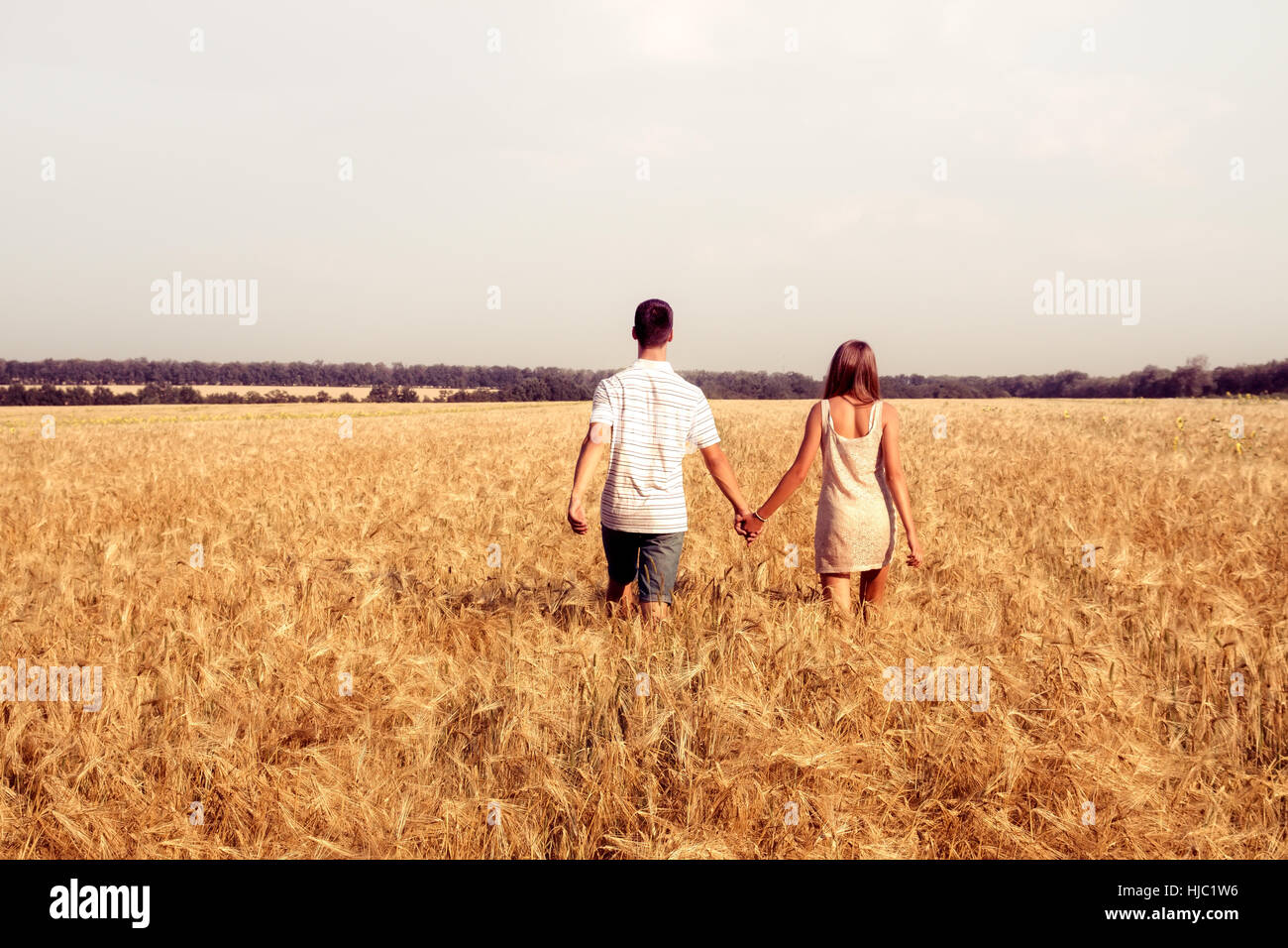 Teen couple walking holding hands hi-res stock photography and images ...