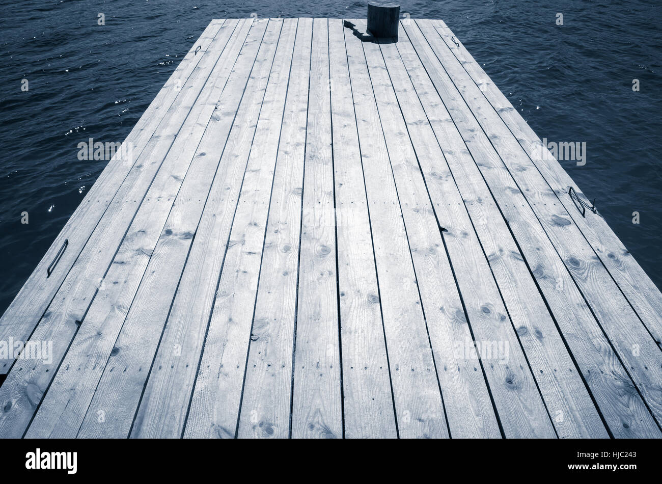 Empty old wooden pier perspective, blue toned photo Stock Photo - Alamy